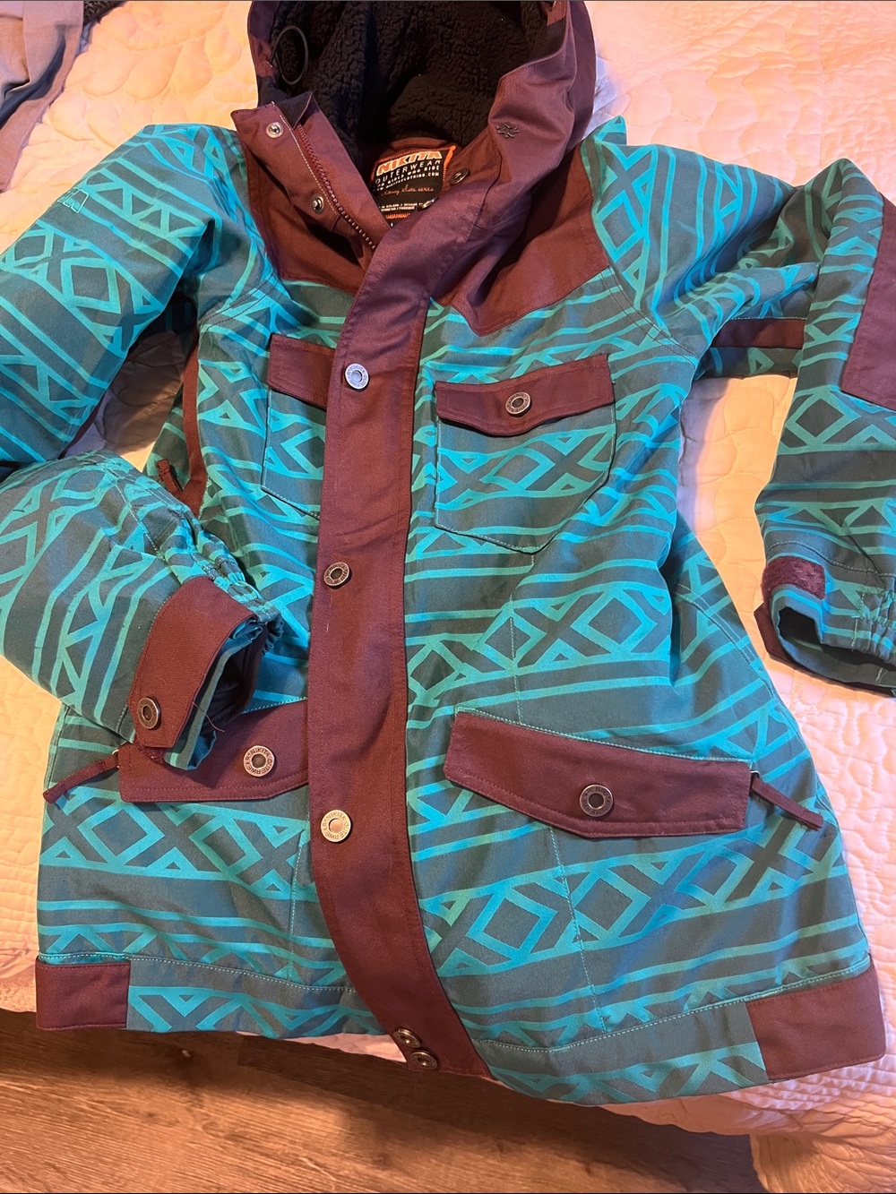 Women's Teal Geometric Ski Jacket with Brown Trim